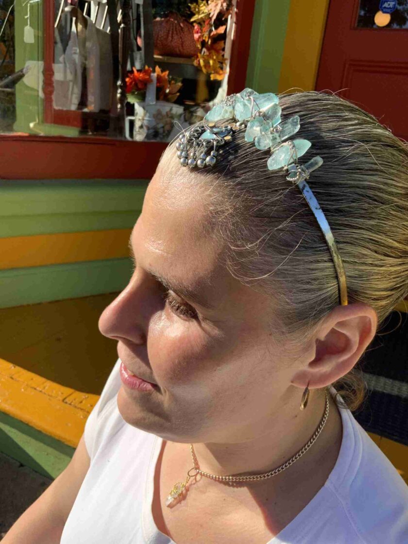 a woman with a flower in her hair.