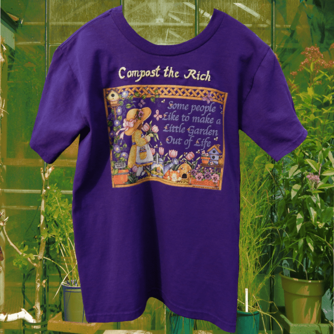 a purple t - shirt with a picture of a little girl on it.