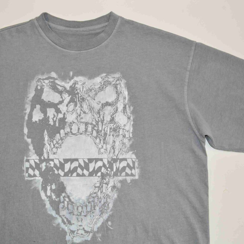 a t - shirt with a picture of a skull on it.