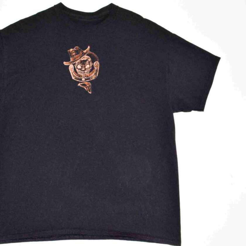 a t - shirt with a picture of a cowboy on it.