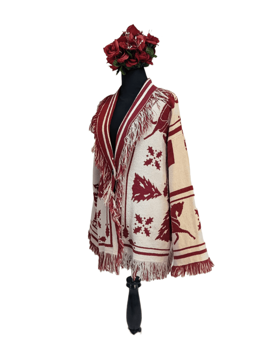 a red and white shawl with a flower on top of it.