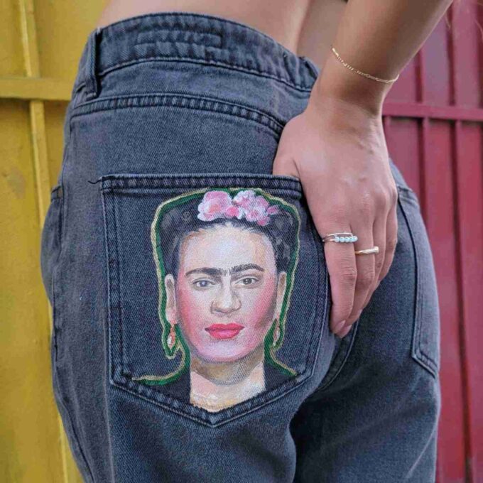 a woman's jeans with a picture of a woman's face in the.