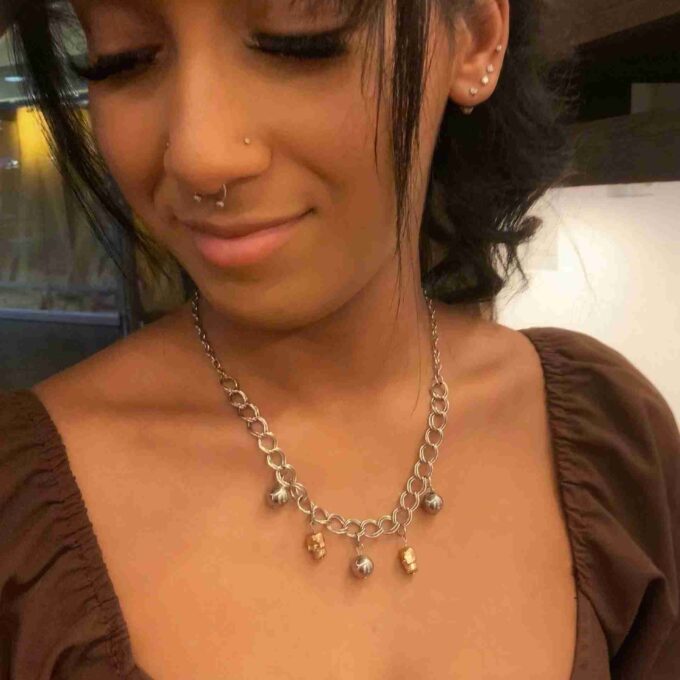 a close up of a person wearing a necklace.