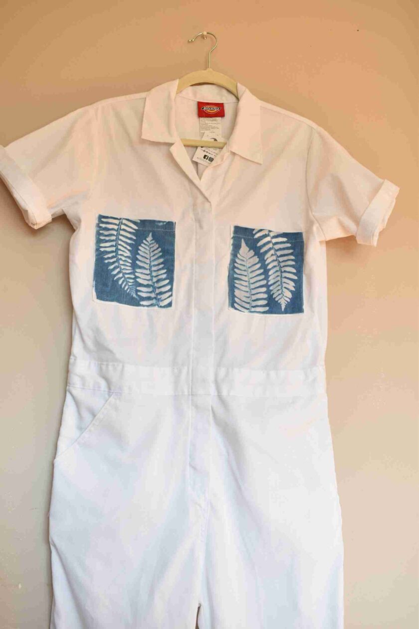 a white shirt with a blue design on it.