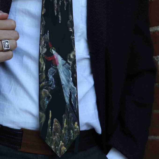 a close up of a person wearing a suit and tie.