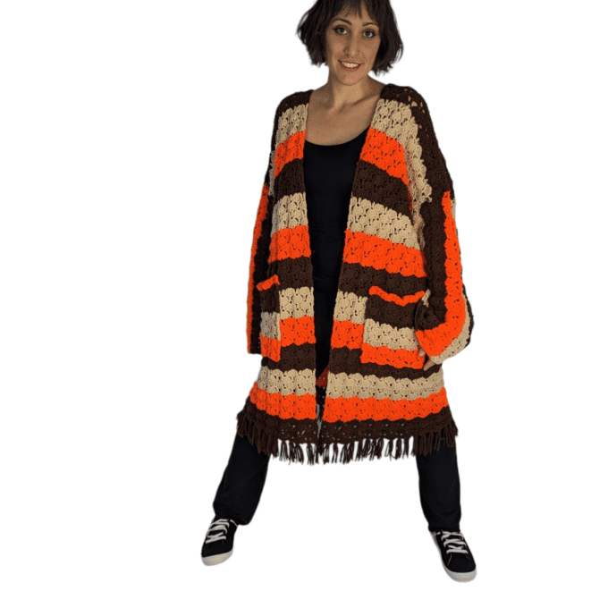 Front view of woman wearing vintage crochet cardigan.