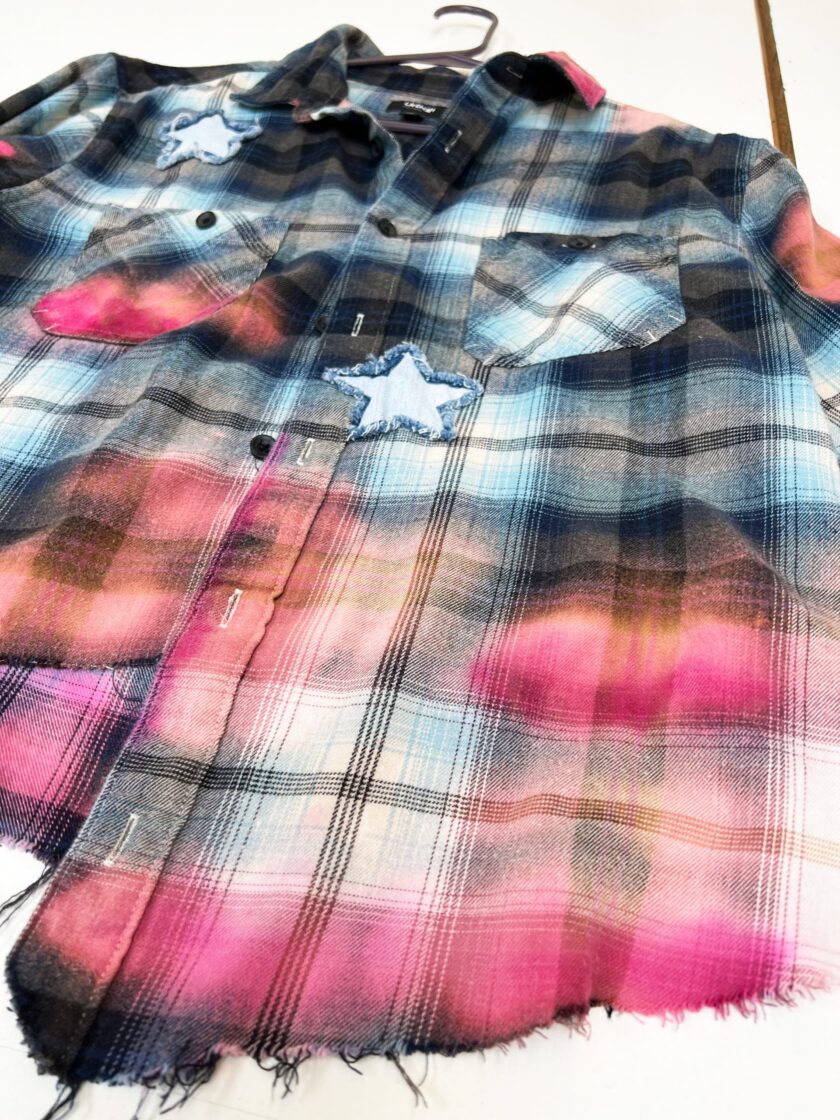 A Sunflower Bleached Flannel shirt with a star on it.