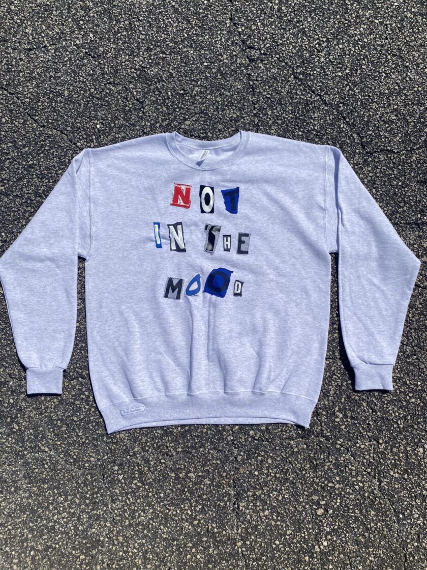 a blue sweatshirt with the words no to the moon printed on it.