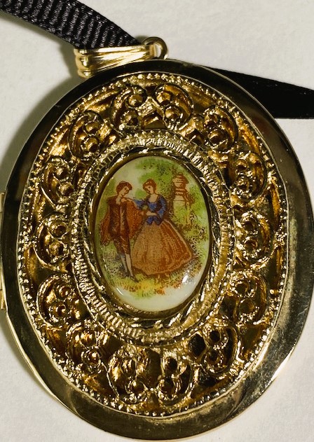 Close up of the locket showing the ribbon cord