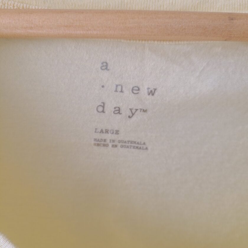a close up of a piece of cloth with a wooden handle.