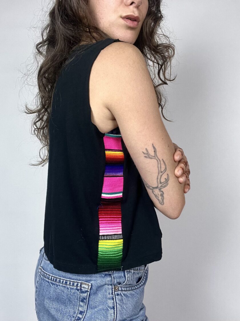 a woman with a tattoo on her arm.
