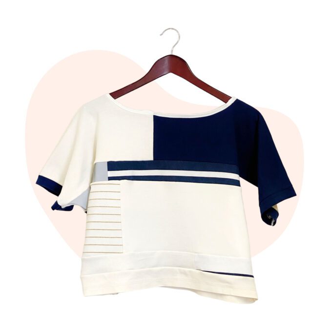 A blue and white drapey patchwork t-shirt top made