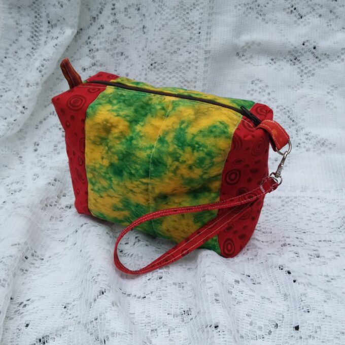 Retro Artsy wristlet handbag with key chain strap in bold red and funky batik