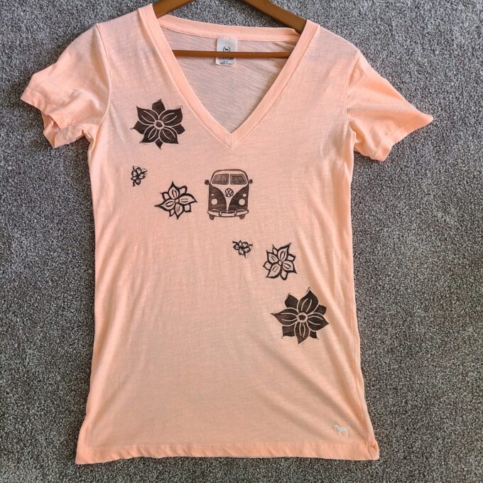 a women's v - neck t - shirt with flowers on it.