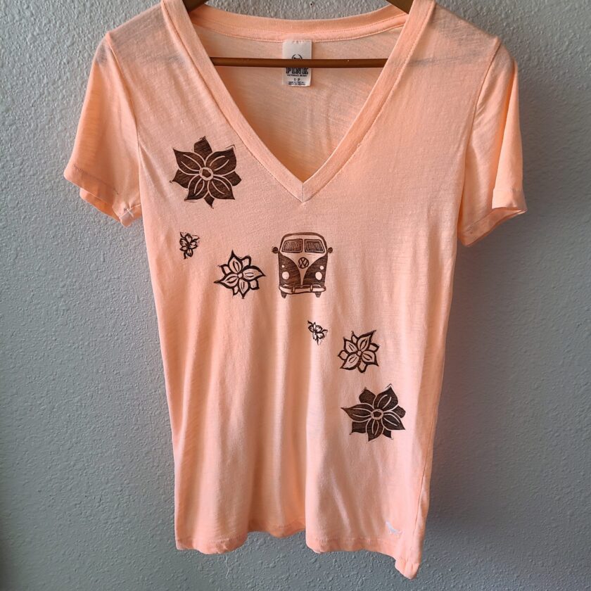 a women's v - neck t - shirt with flowers on it.