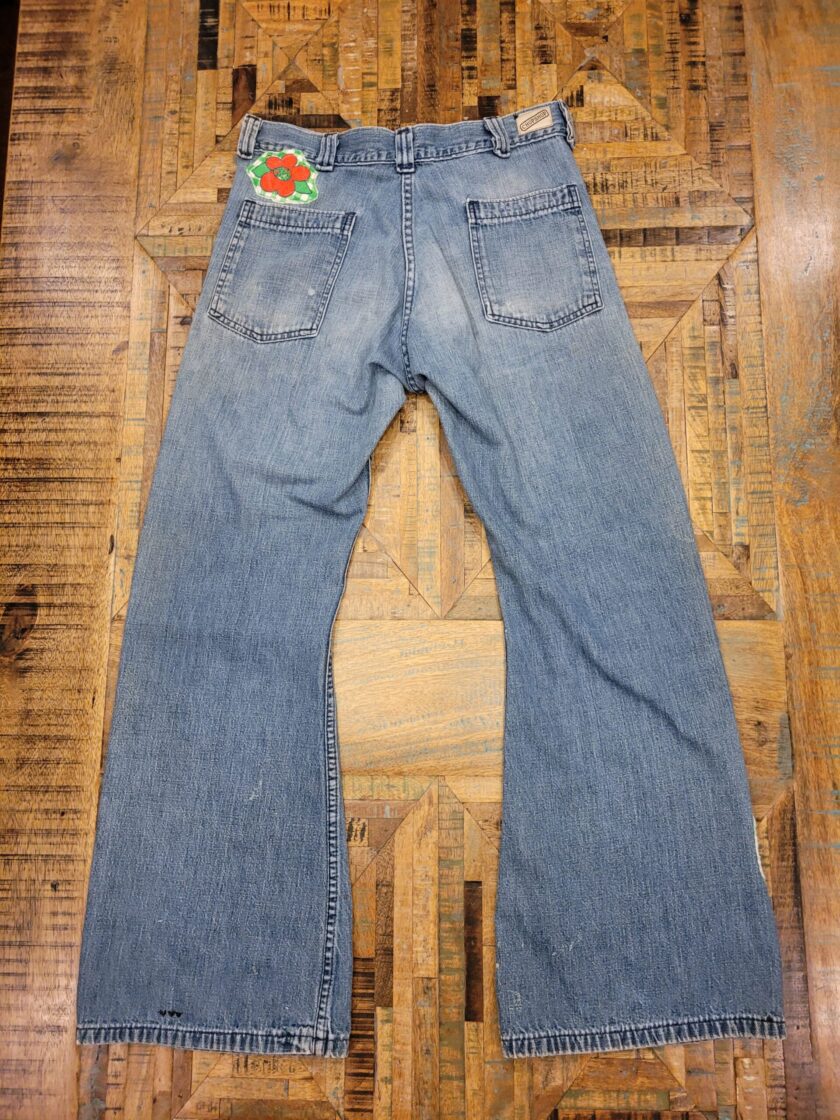 a pair of jeans with a patch on them.