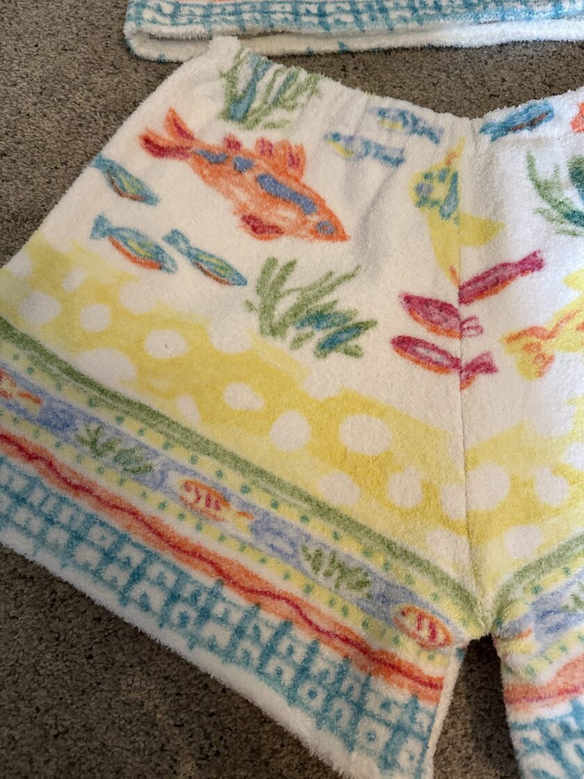 a pair of colorful shorts with fish on them.