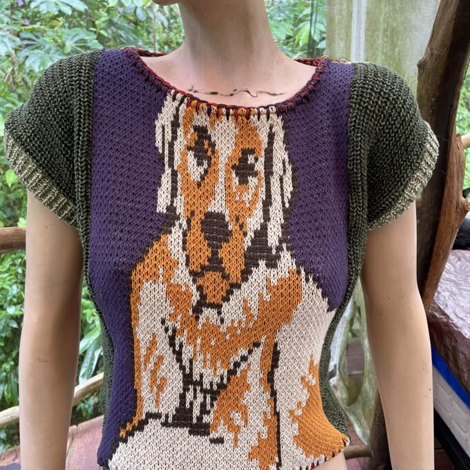 a mannequin wearing a sweater with a dog on it.