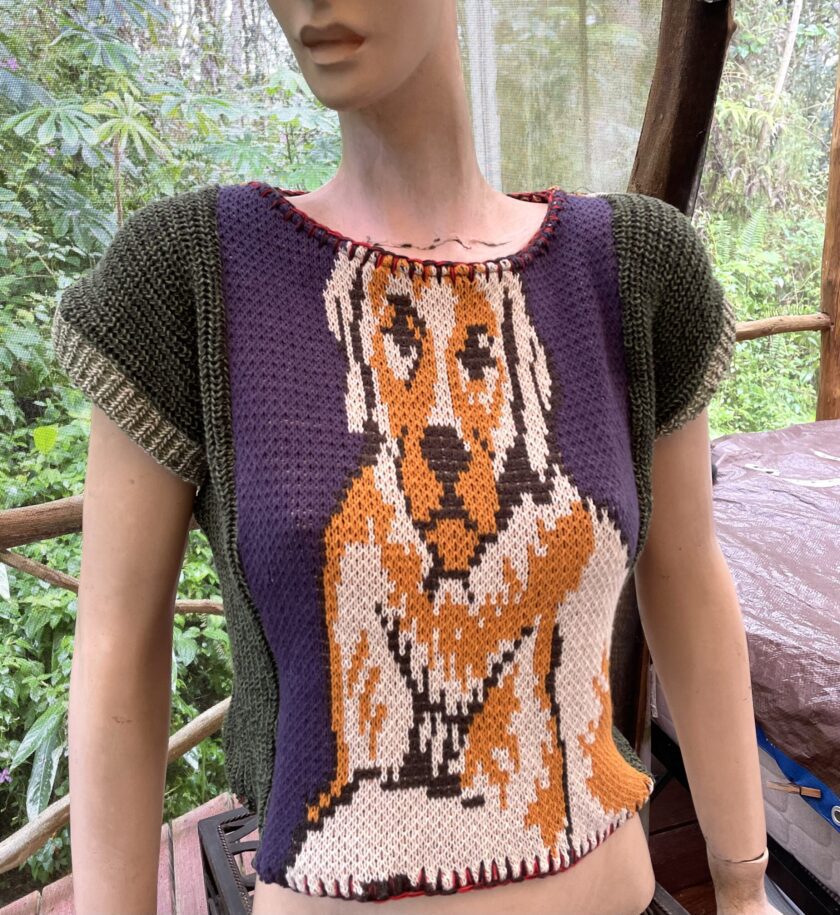 a mannequin wearing a sweater with a dog on it.