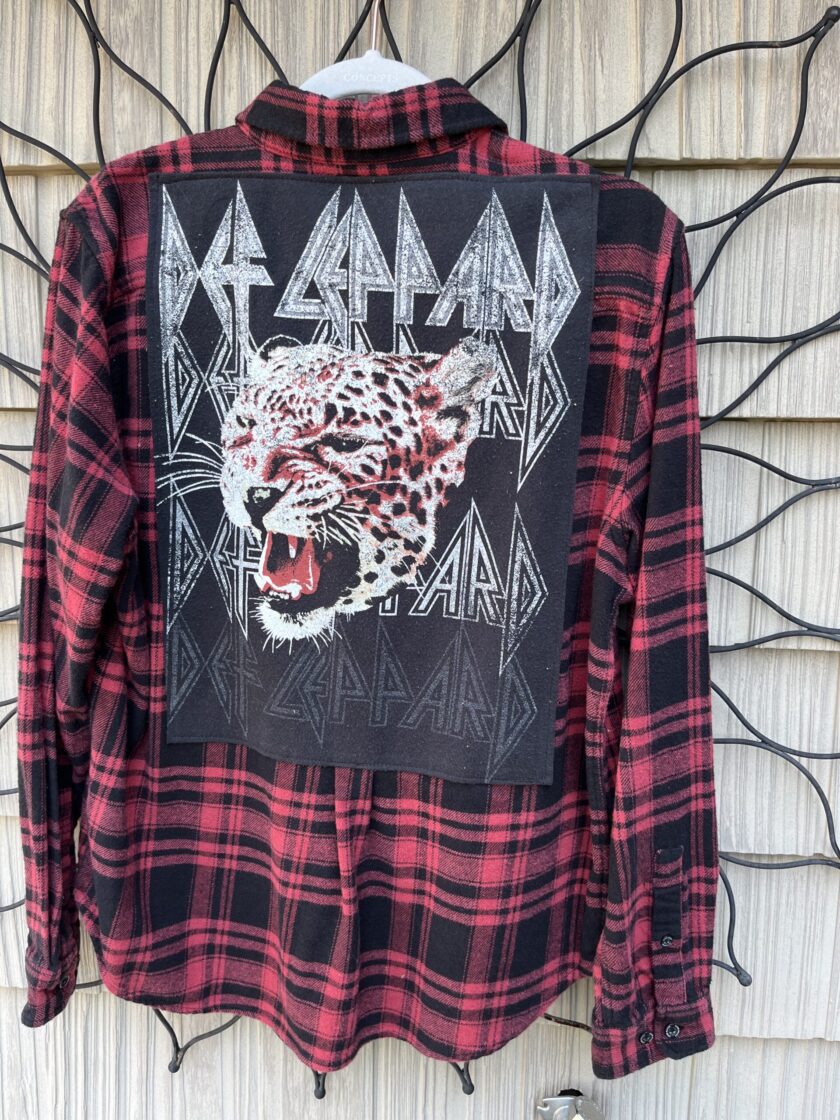 A plaid shirt with an image of a tiger on it.