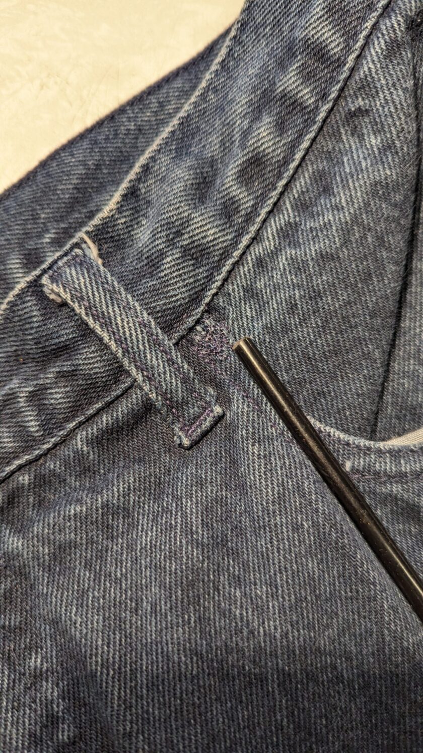 A close up of the pocket of a pair of jeans.
