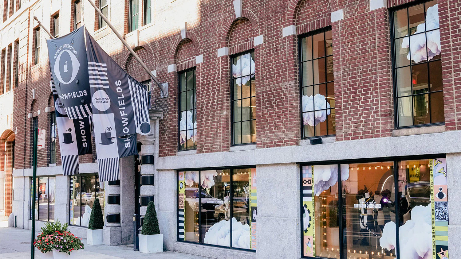 The front of a brick building with a sign on it.