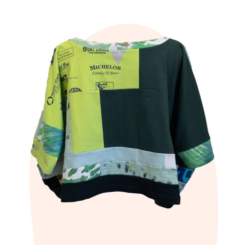 A green top with a pattern on it.