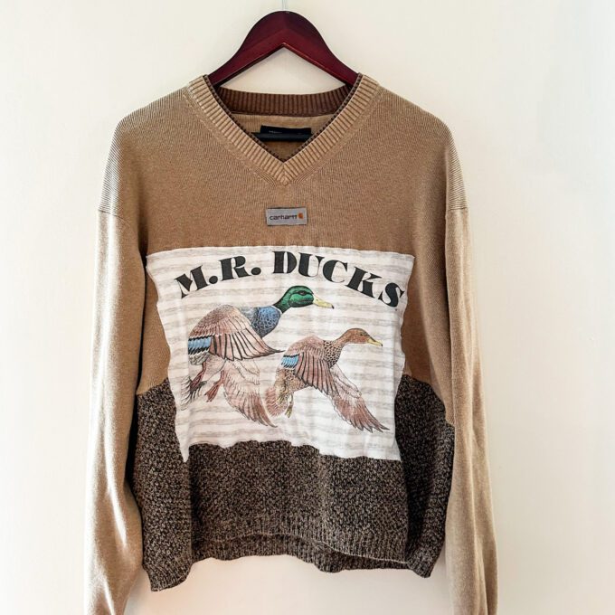 A sweater with the words mr ducks on it.