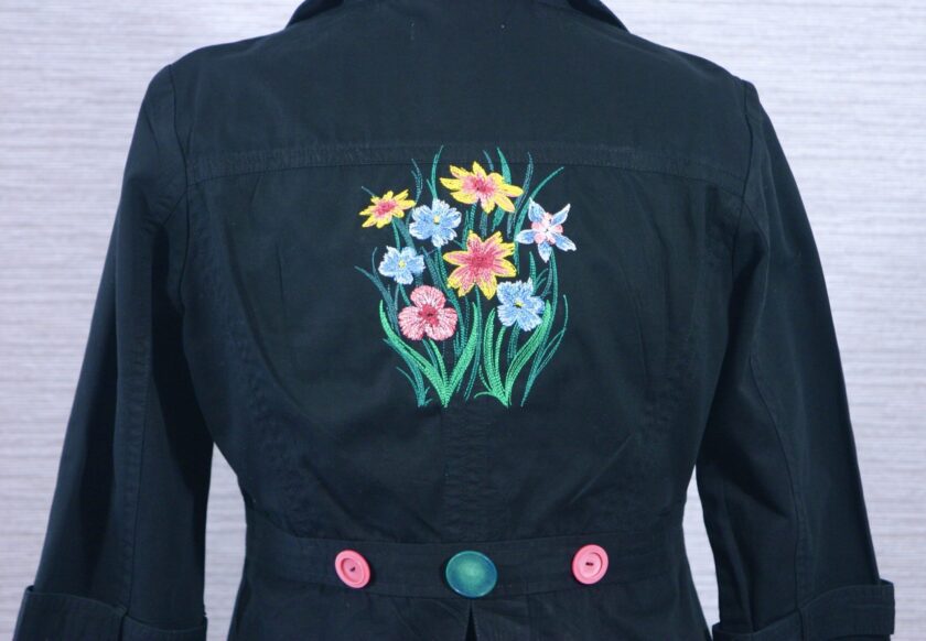A black jacket with embroidered flowers on the back.