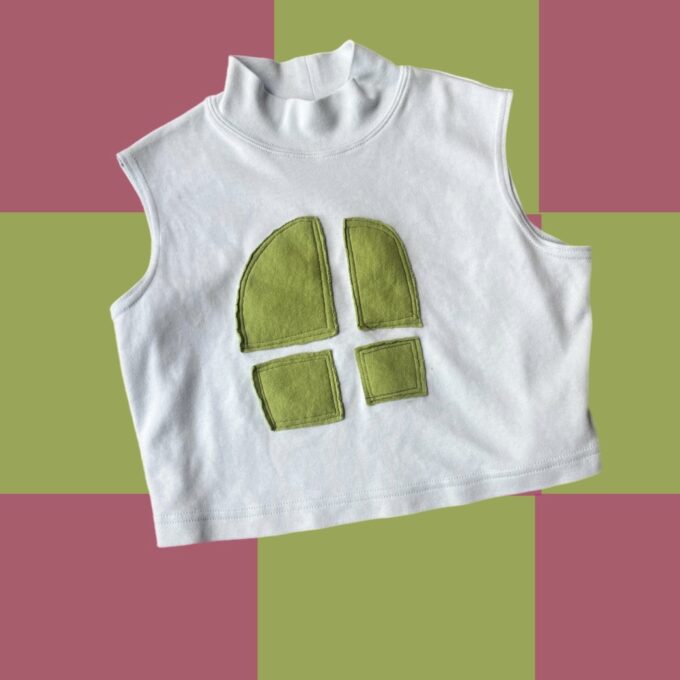 A white t - shirt with a green window on it.