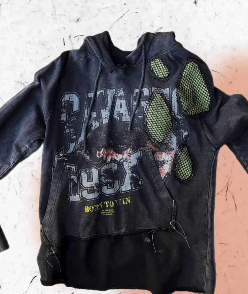 A black hoodie with green patches on it.